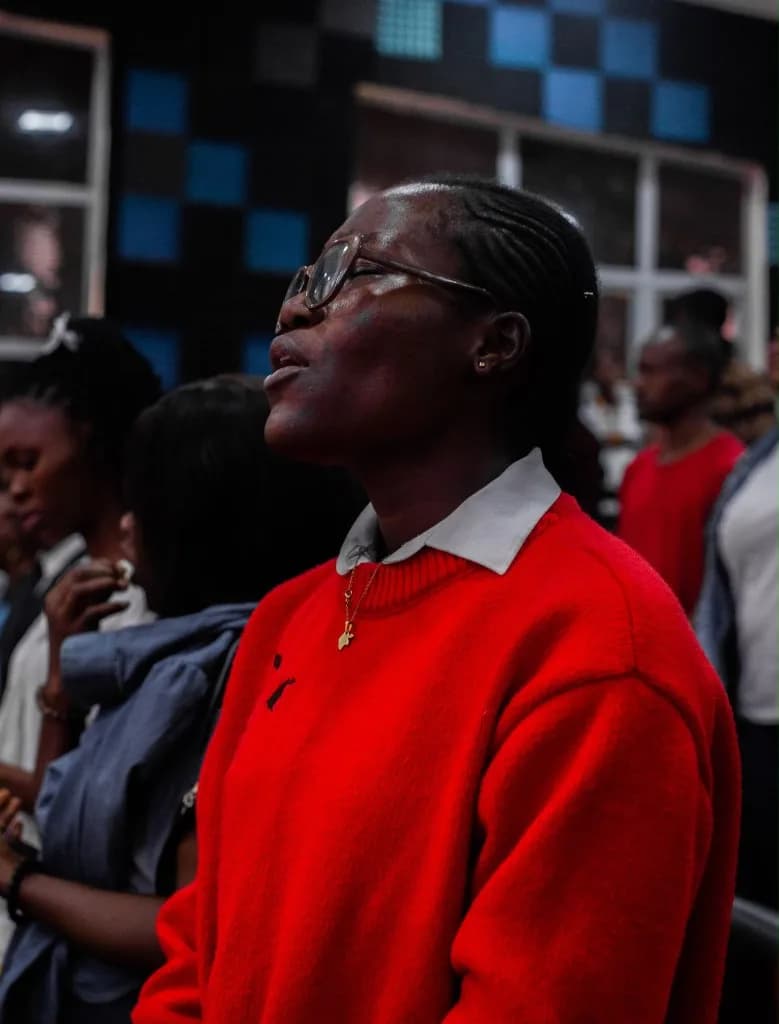 Delegates celebrating in the aisle during an AYAC service