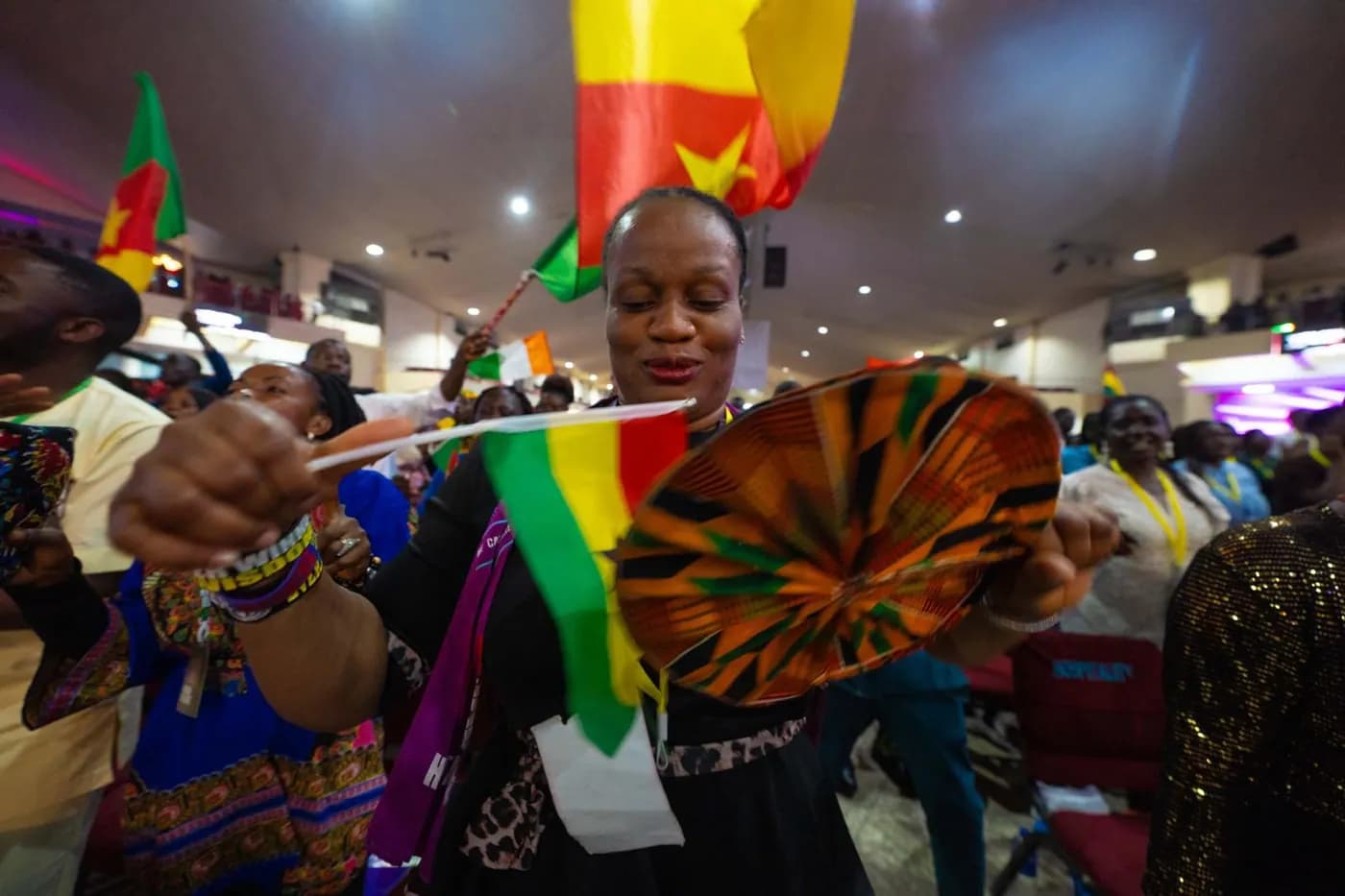 Delegates dancing with cultural flags during AYAC variety night
