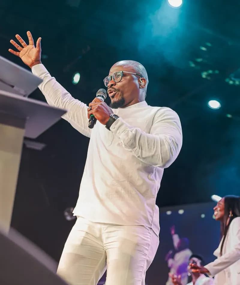 A minister preaching on stage at Youth Alive USA
